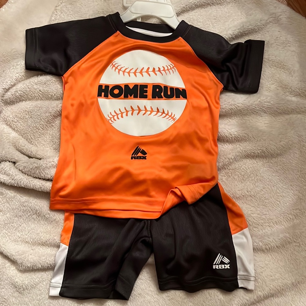 Boys 2 pc shirt and short. RBX brand. NWT Orange and blue.  Smoke free home